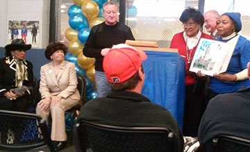 Advisory Council President Delores Capers accepts a citation honoring the Laura Sims Skate House's 30th anniversary